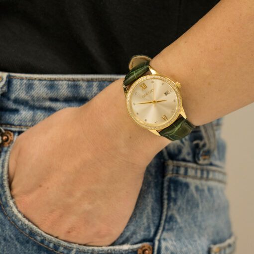 Γυναικείο ρολόι GREGIO Elise GR320020 Γυναικείο ρολόι Gregio με χρυσό χρώμα καντράν και δερμάτινο πράσινο λουράκι.